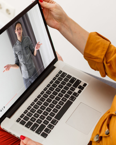 Close-up Of Businesswoman Video Conferencing With Colleague On Laptop