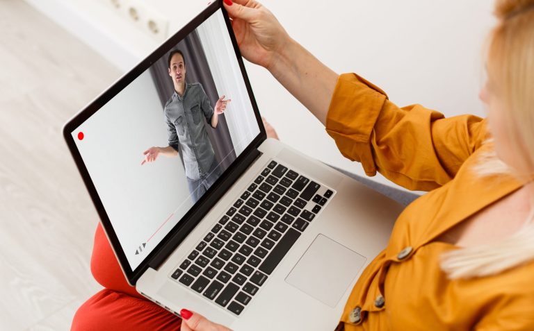 Close-up Of Businesswoman Video Conferencing With Colleague On Laptop
